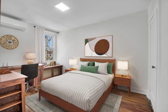 39-39 46th St, New York City, NY 11104 - bedroom featuring baseboards, a wall mounted AC, and wood finished floors