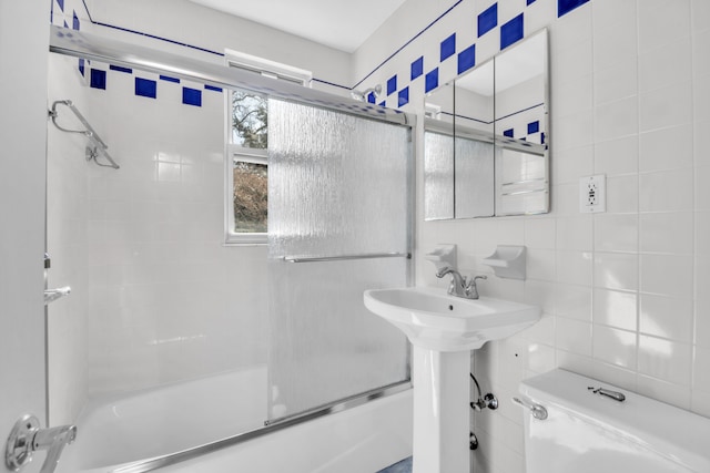 39-39 46th St, New York City, NY 11104 - bathroom with enclosed tub / shower combo, toilet, and tile walls