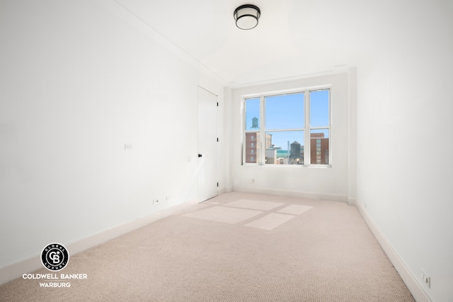 unfurnished room featuring carpet flooring