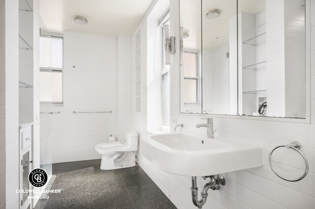 420 Riverside Dr Unit 12H, New York City, NY 10025 - bathroom featuring granite tiled floors and toilet