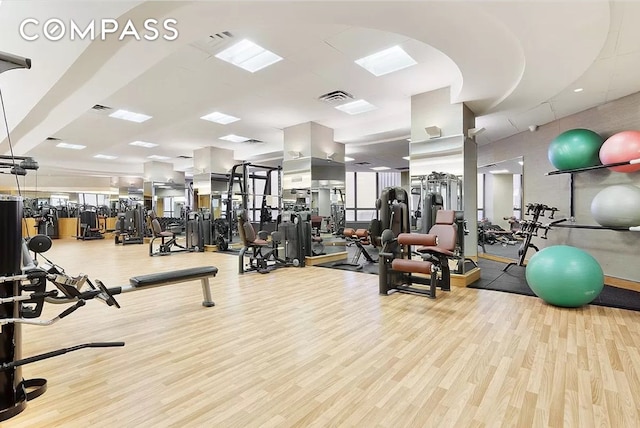 exercise room with wood finished floors