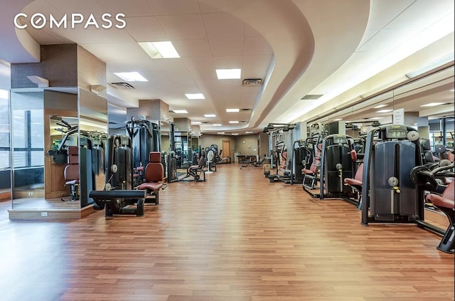 workout area with wood finished floors
