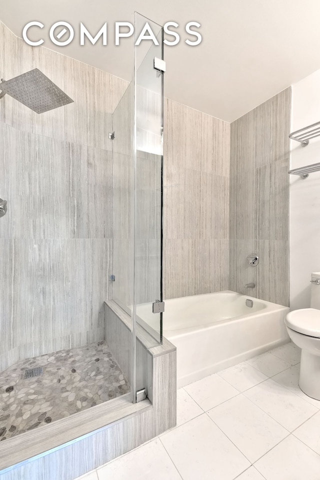 full bath featuring tiled shower, toilet, tile patterned flooring, and a bath