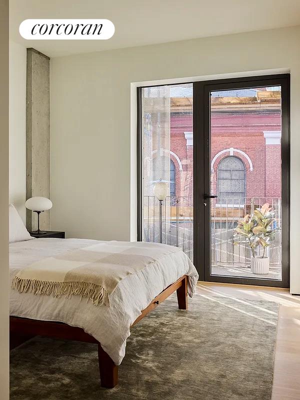 9 Chapel St Unit 5C, New York City, NY 11201 - bedroom with access to outside and wood finished floors