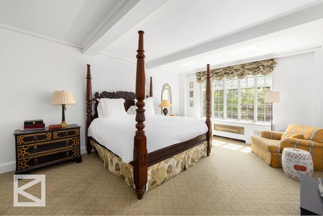 carpeted bedroom with beamed ceiling