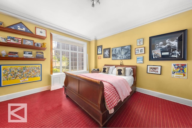 bedroom with baseboards, ornamental molding, and dark colored carpet