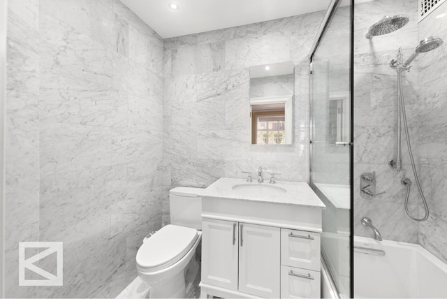 115 E 67th St Unit 3D/4D, New York City, NY 10065 - bathroom with vanity, shower / bath combination, toilet, and tile walls