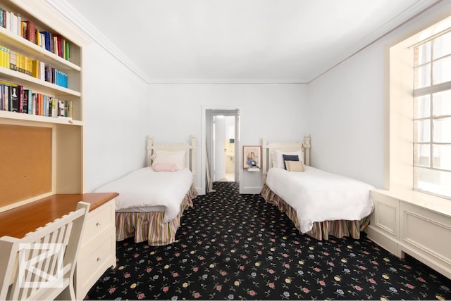 carpeted bedroom with ornamental molding