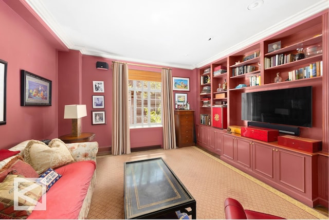 living room with crown molding, baseboards, and light carpet