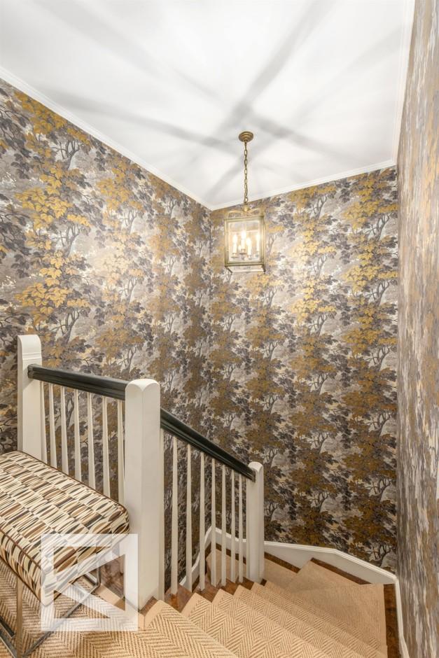 115 E 67th St Unit 3D/4D, New York City, NY 10065 - staircase with wallpapered walls and ornamental molding