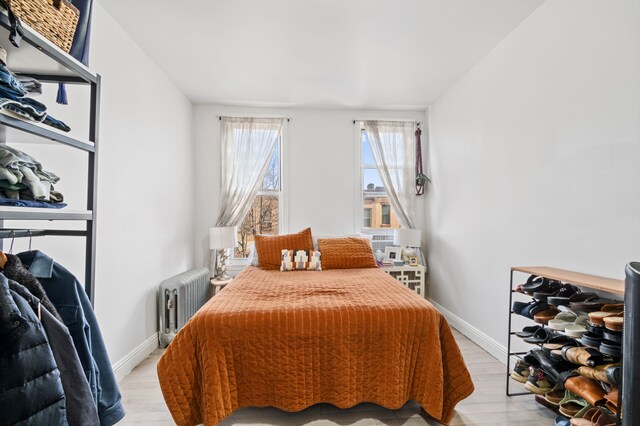 206A 29th St, New York City, NY 11232 - bedroom featuring light wood-style flooring, baseboards, and radiator
