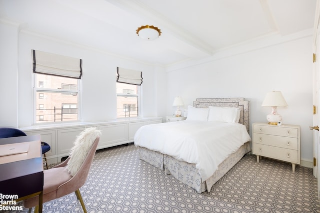 bedroom featuring ornamental molding and beam ceiling