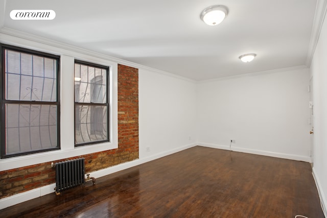 24-65 38th St Unit A5, New York City, NY 11103 - unfurnished room with radiator heating unit, baseboards, wood finished floors, and ornamental molding