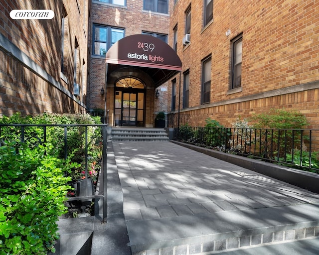 24-65 38th St Unit A5, New York City, NY 11103 - view of exterior entry with brick siding and cooling unit