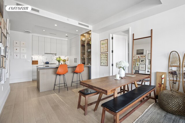 438 E 12th St Unit 6C, New York City, NY 10009 - dining space with light wood-style flooring and recessed lighting