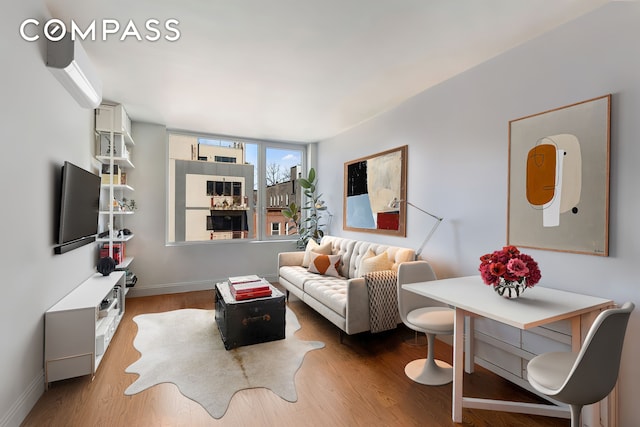 954 Bergen St Unit 5D, New York City, NY 11216 - living room featuring wood finished floors and baseboards