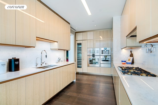 35 Hudson Yards Unit 5504, New York City, NY 10001 - kitchen featuring modern cabinets, a sink, light countertops, stainless steel appliances, and dark wood finished floors