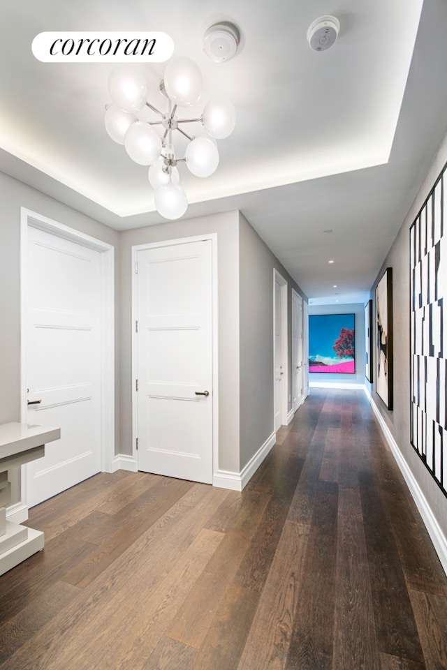 35 Hudson Yards Unit 5504, New York City, NY 10001 - hall with a chandelier, wood finished floors, and baseboards