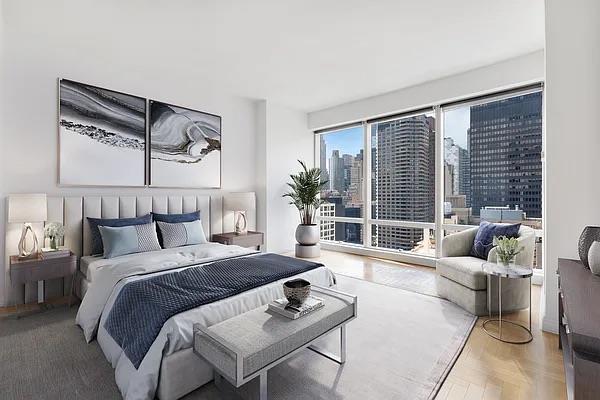 845 United Nations Plz Unit 7-H, New York City, NY 10017 - bedroom featuring a city view and access to exterior