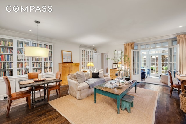living room featuring recessed lighting, dark wood finished floors, and crown molding