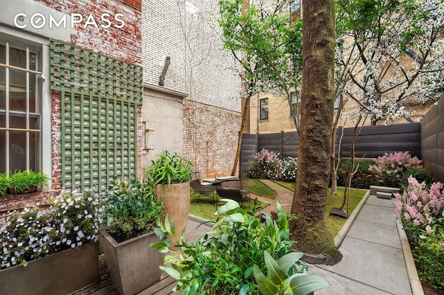 view of yard with fence and a patio