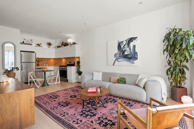 living area with light wood-style floors