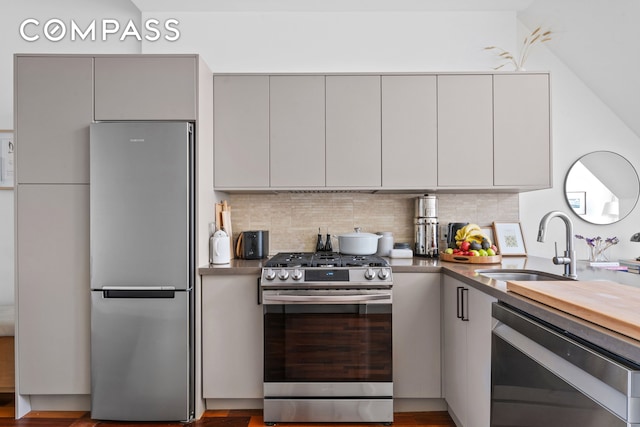 131 Jackson St Phb, Phb, New York City, NY 11211 - kitchen featuring appliances with stainless steel finishes, gray cabinets, a sink, and tasteful backsplash