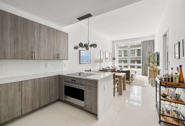 111 Fulton St Unit 318, New York City, NY 10038 - kitchen with oven, modern cabinets, open floor plan, and a peninsula