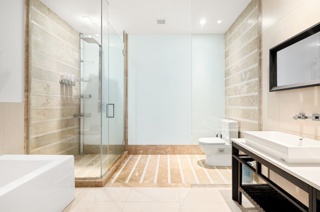 111 Fulton St Unit 318, New York City, NY 10038 - bathroom with toilet, a stall shower, vanity, tile patterned floors, and a garden tub
