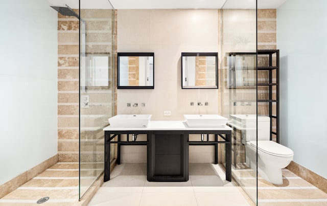 111 Fulton St Unit 318, New York City, NY 10038 - full bath featuring walk in shower, double vanity, toilet, and tile patterned floors