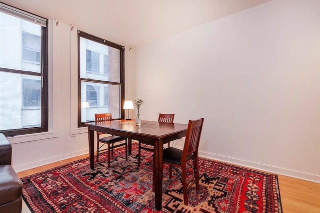 56 Pine St Unit 8G, New York City, NY 10005 - dining space featuring healthy amount of natural light and light wood-style floors