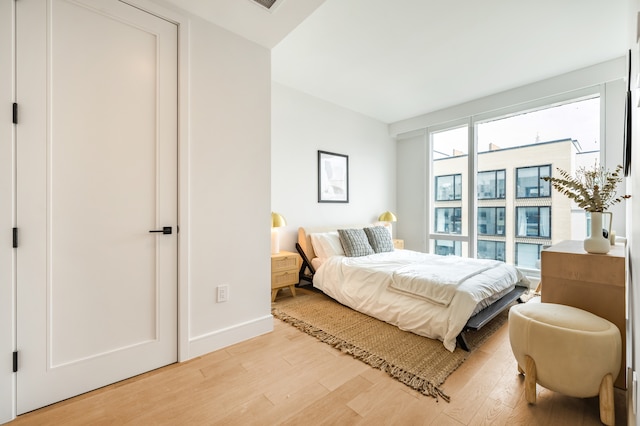 37-34 33rd St Unit 3-K, New York City, NY 11101 - bedroom featuring light wood-style flooring and baseboards