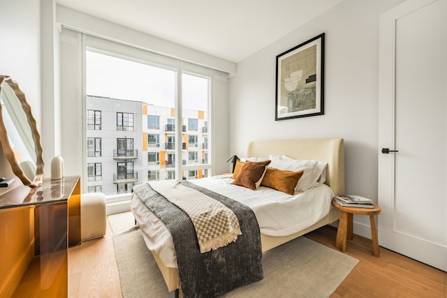 bedroom with light wood-type flooring