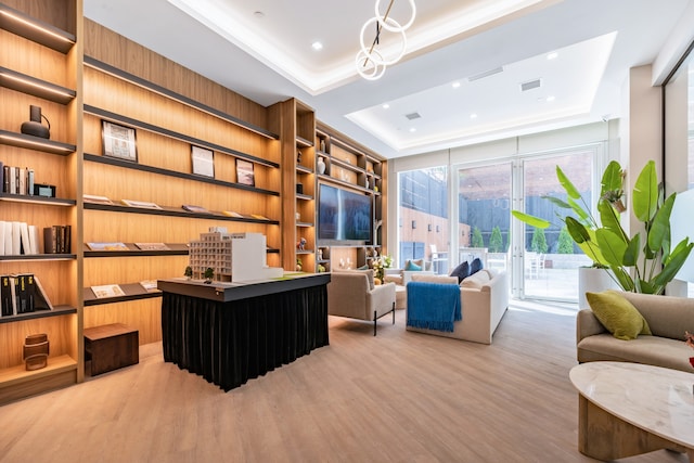 37-34 33rd St Unit 3-K, New York City, NY 11101 - office space featuring a tray ceiling, wood finished floors, built in shelves, and recessed lighting