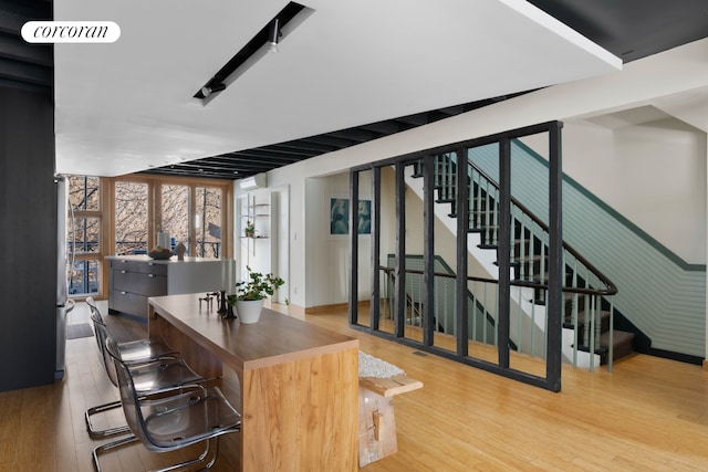 126 2nd St, New York City, NY 11231 - office space featuring floor to ceiling windows, wood finished floors, and visible vents