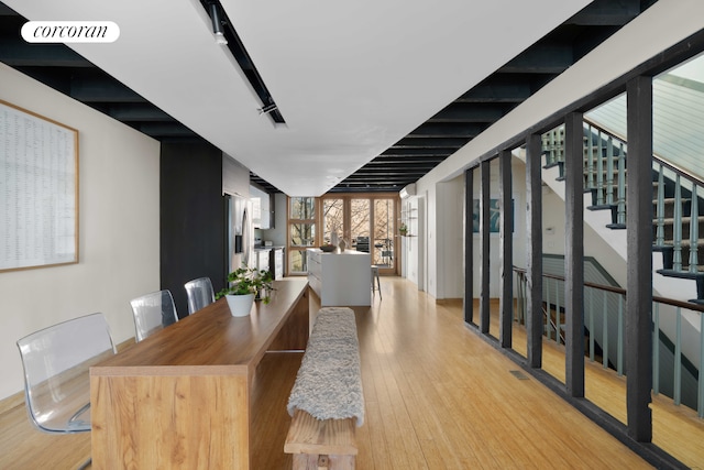 126 2nd St, New York City, NY 11231 - dining space featuring light wood-style floors, stairs, and visible vents