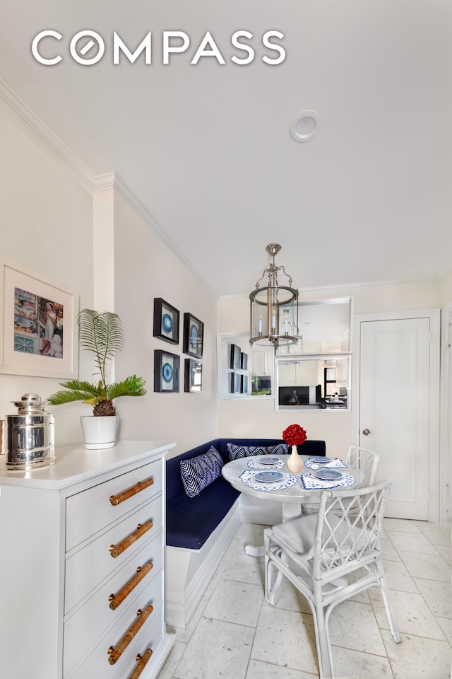 65 E 96th St Unit 15D, New York City, NY 10128 - dining space with breakfast area, ornamental molding, and a chandelier