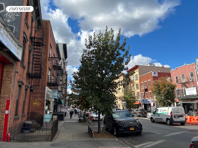 550 Metropolitan Avenue Commercial, New York City, NY 11211 - view of asphalt road featuring sidewalks, curbs, and street lighting