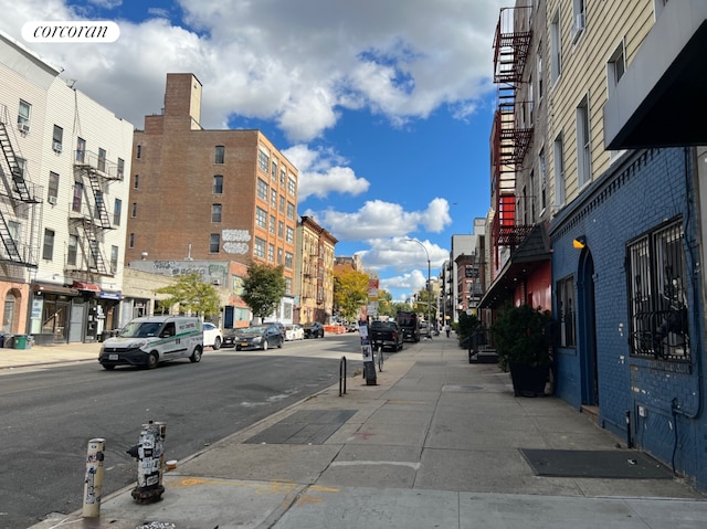 550 Metropolitan Avenue Commercial, New York City, NY 11211 - view of asphalt street featuring sidewalks, street lights, and curbs