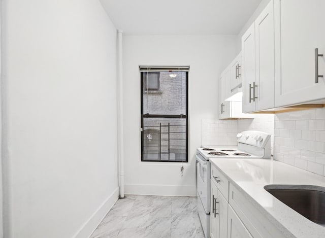 137 W 142nd St Unit 3A, New York City, NY 10030 - kitchen with tasteful backsplash, baseboards, white cabinets, white electric range, and marble finish floor