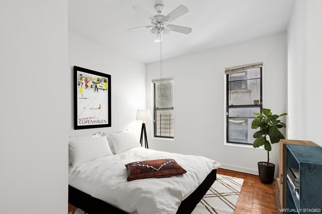 137 W 142nd St Unit 3A, New York City, NY 10030 - bedroom featuring baseboards and a ceiling fan