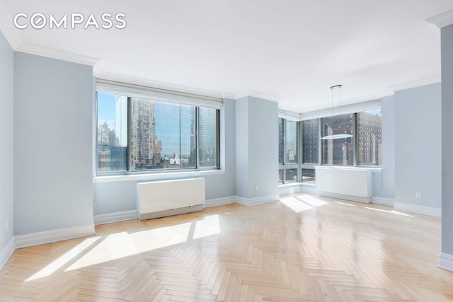 spare room with baseboards and plenty of natural light
