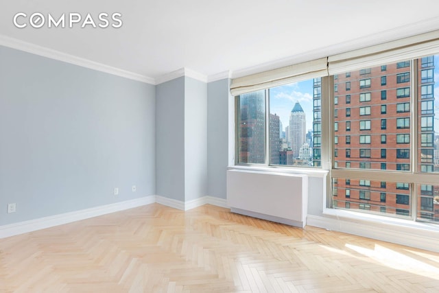 2 Columbus Ave Unit 17C, New York City, NY 10023 - spare room with baseboards, a skyline view, and crown molding