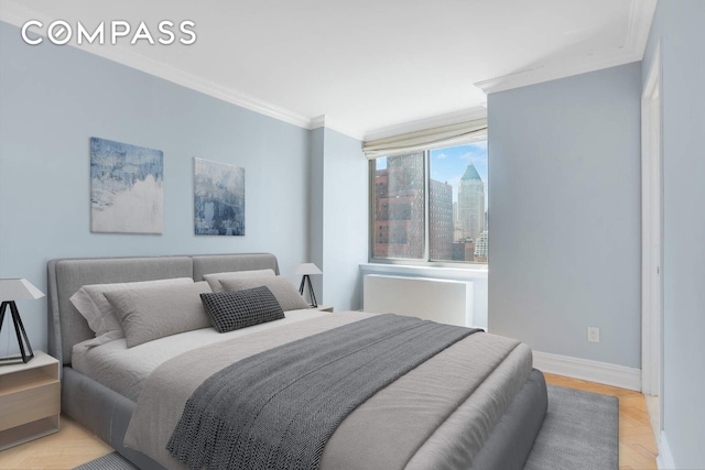 bedroom featuring a view of city, baseboards, and ornamental molding