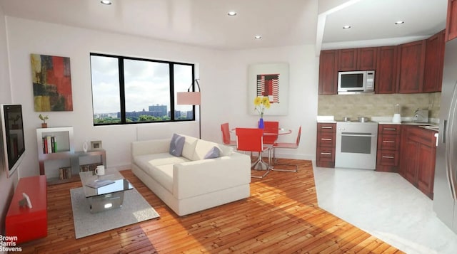 456 W 167th St Unit 7B, New York City, NY 10032 - living area featuring light wood finished floors, recessed lighting, and baseboards
