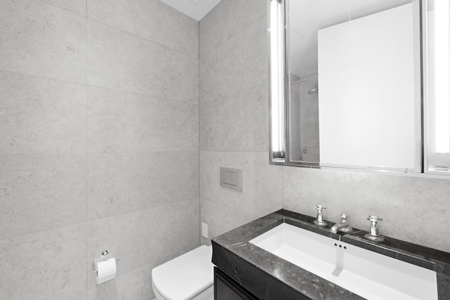 5 Beekman St Unit 22C, New York City, NY 10038 - bathroom featuring vanity, toilet, and tile walls