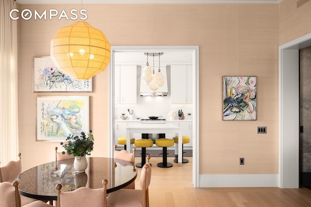 200 E 83rd St Unit 24C, New York City, NY 10028 - dining area with light wood finished floors and baseboards
