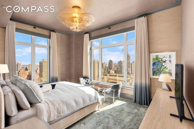 200 E 83rd St Unit 24C, New York City, NY 10028 - bedroom featuring a view of city and carpet