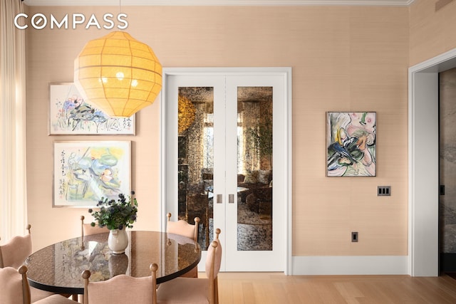 200 E 83rd St Unit 24C, New York City, NY 10028 - doorway to outside with french doors and wood finished floors
