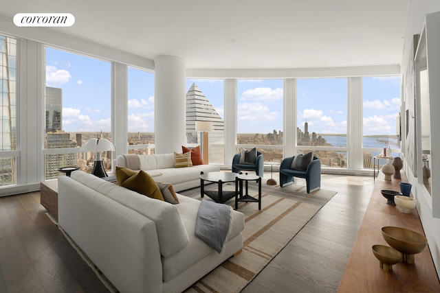 35 Hudson Yards Unit 7403, New York City, NY 10001 - living area with healthy amount of natural light, wood finished floors, floor to ceiling windows, and a water view